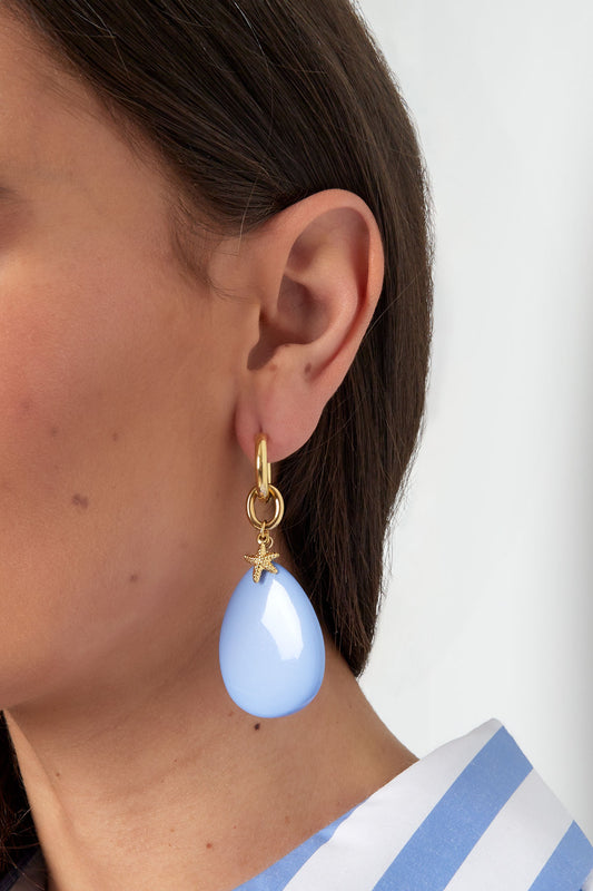 Oorbellen met ovalen hanger en zeester bedel - blauw/goud